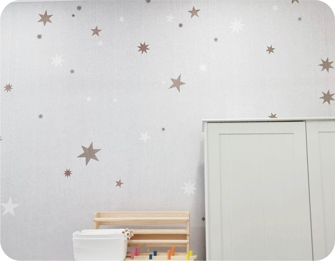 a kids room after being wrapped by Rebel Walls stargazing wallpaper